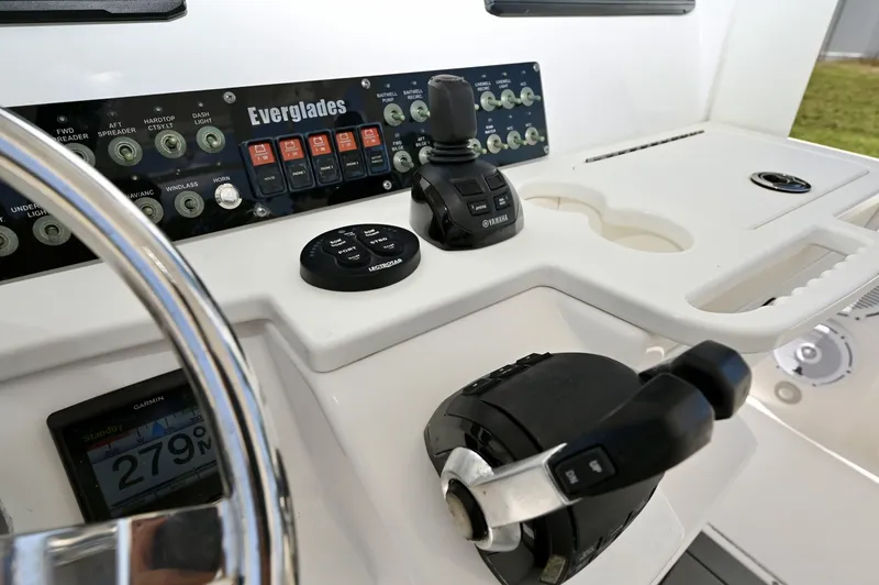 Slide: The Image of  Switch Panel & Trim Tabs Everglades rocker panel, Lectrotab control, Yamaha joystick and gauge. - 6788452