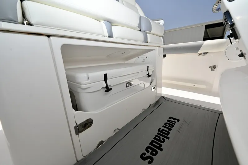Slide: The Image of Slide-Out Yeti Cooler 94-quart Yeti in the seat-base drawer, raw water washdown at the aft cockpit. - 6788448