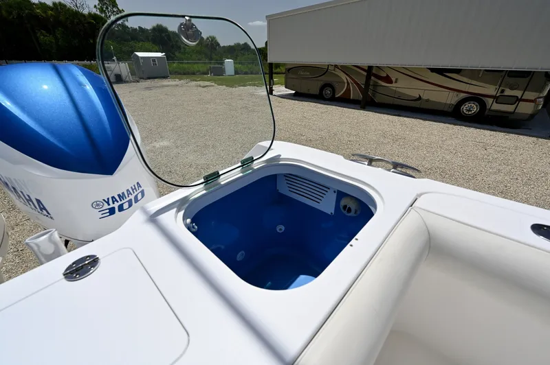 Slide: The Image of Transom Livewell Lighted blue livewell with aerator under a clear lid, port side aft.  - 6788442