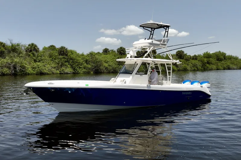 Slide: The Image of At Rest, Port Side 355 CC at idle, tower and open array radar, blue Yamaha cowls. - 6788438