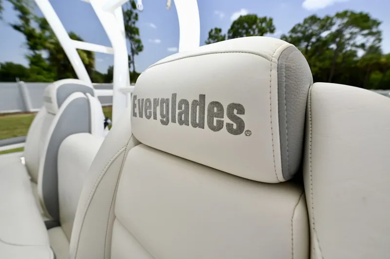 Slide: The Image of Everglades Helm Seat Embroidered bolstered helm chair, showing upholstery condition. - 6788449