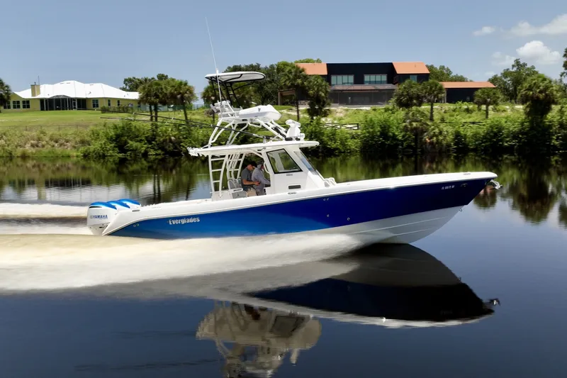Slide: The Image of Cruising the Intracoastal Mid Atlantic Blue Awlcraft hull underway, full port profile. - 6788436