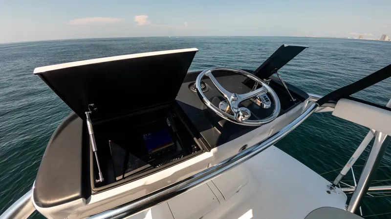 Slide: The Image of 2021 65 Hatteras GT On the DL Tower Helm (2) - 7403489