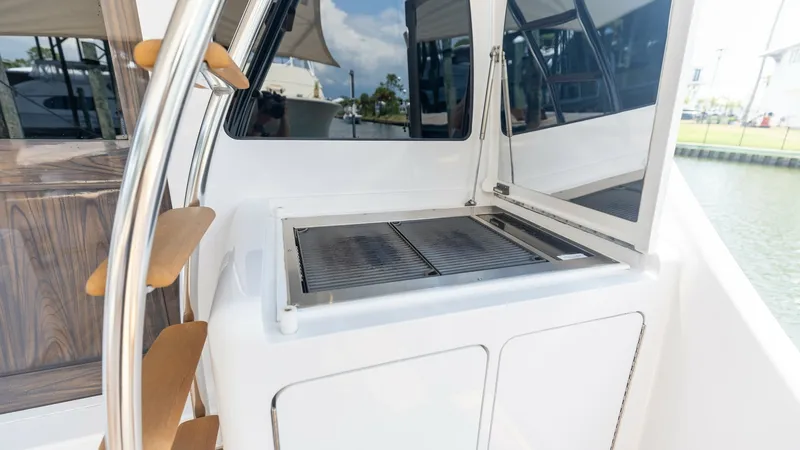 Slide: The Image of 2021 65 Hatteras GT On the DL Cockpit Grill (2) - 7403471