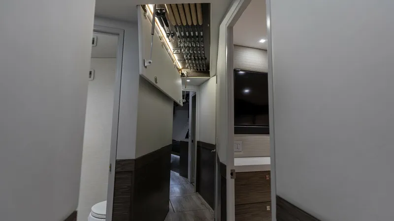 Slide: The Image of 2021 65 Hatteras GT On the DL Companionway with Concealed overhead Rod Storage - 7403434