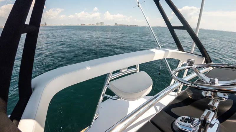 Slide: The Image of 2021 65 Hatteras GT On the DL Tower Helm (4) - 7403491