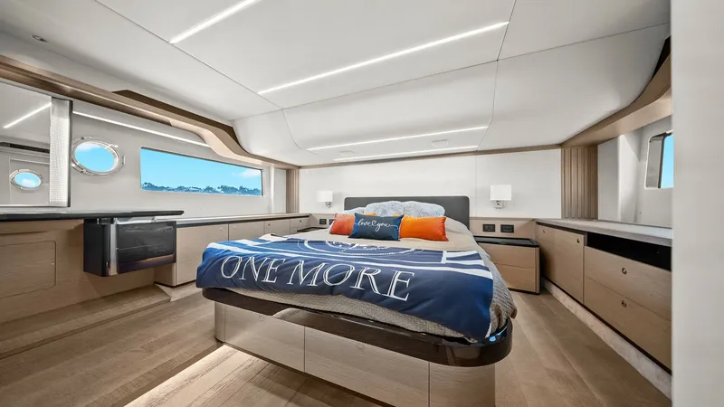 Slide: The Image of Luxurious Master Stateroom The master stateroom aboard the 2024 Absolute 52 Navetta 'One More' offers an elegant retreat with a spacious layout and modern design. Featuring a centrally positioned bed, ample storage, and sleek cabinetry, this room is both functional and stylish. Lar - 6851827