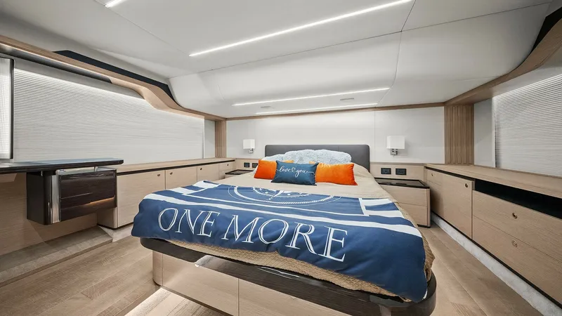 Slide: The Image of Luxurious Master Stateroom The master stateroom aboard the 2024 Absolute 52 Navetta showcases a blend of modern elegance and comfort. Featuring a spacious layout, the room is adorned with sleek wood finishes and ambient LED lighting. The plush bed, complemented by ample storage and - 6851825