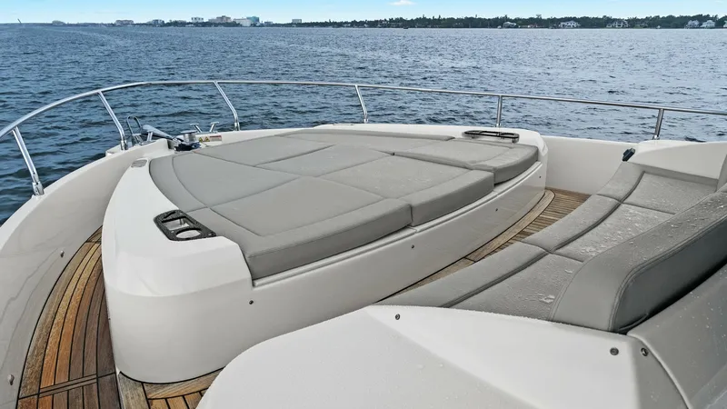Slide: The Image of Bow Sunbathing Area with Cushions The bow of the Absolute 52 Navetta features a spacious sunbathing area with plush gray cushions, perfect for relaxation while enjoying panoramic ocean views. The sleek design includes integrated cup holders and teak decking, adding both functionality and - 6851869