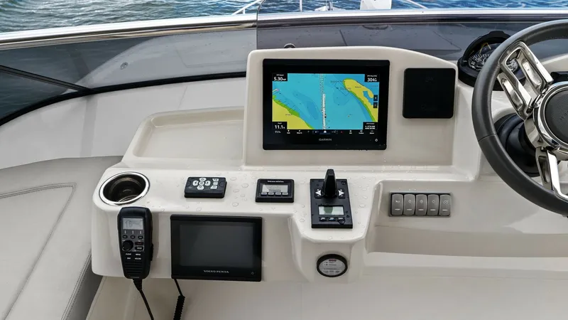 Slide: The Image of Flybridge Helm Station The helm station on the Absolute 52 Navetta features state-of-the-art navigation technology, including a sleek multifunction display and advanced controls. The ergonomic design ensures comfort during long voyages, with intuitive access to all instruments - 6851775