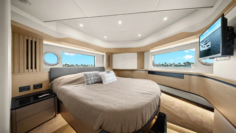 Slide: The Image of Forward Master Stateroom This luxurious forward master stateroom on the 2024 Absolute 52 Navetta features expansive windows providing panoramic views and abundant natural light. The plush central bed is complemented by elegant wood finishes and modern LED lighting. Thoughtfully d - 6851816