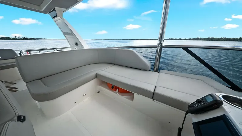 Slide: The Image of Flybridge Seating Area with Ocean View This inviting flybridge seating area on the 2024 Absolute 52 Navetta offers a perfect blend of comfort and style. The plush L-shaped seating provides ample space for relaxation while enjoying panoramic ocean views. With sleek lines and high-quality uphols - 6851778
