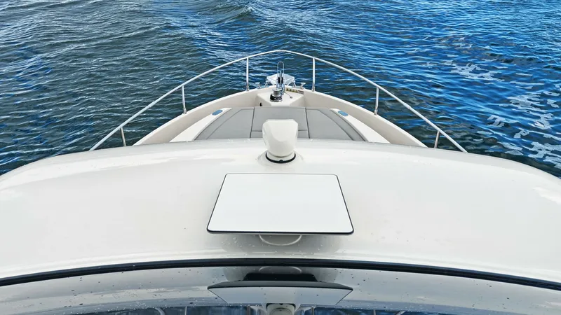 Slide: The Image of Bow View with Anchor System This image showcases the sleek bow of the 2024 Absolute 52 Navetta, featuring a streamlined design and advanced anchor system. The expansive deck provides a perfect vantage point for navigating open waters. The high-quality finishes and modern lines highl - 6851870