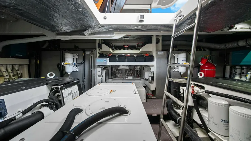 Slide: The Image of Engine Room with Modern Equipment This image showcases the meticulously organized engine room of the Absolute 52 Navetta. Featuring state-of-the-art machinery, the space is designed for optimal functionality and ease of maintenance. The well-lit area includes advanced filtration systems a - 6851838