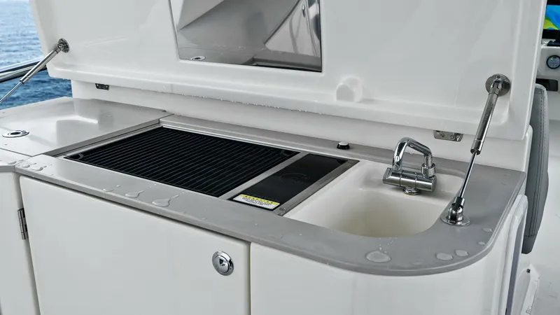 Slide: The Image of Outdoor Galley with Grill and Sink This image showcases the outdoor galley of the 2024 Absolute 52 Navetta, featuring a sleek grill and integrated sink. The well-designed space is perfect for alfresco dining and entertaining, with durable materials that ensure longevity and easy maintenanc - 6851781
