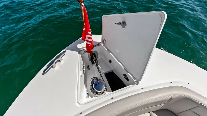 Slide: The Image of Bow Anchor Locker with Windlass This image showcases the bow of the MJM M3, featuring a neatly integrated anchor locker. The locker houses a robust windlass system, providing effortless anchor management. The spacious area is designed for easy access and maintenance, complemented by a s - 6834911