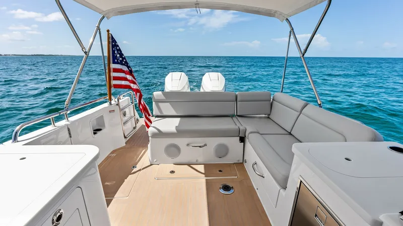 Slide: The Image of Spacious Aft Deck with Seating This aft deck of the 2025 MJM M3 offers a luxurious outdoor seating area, perfect for entertaining and enjoying the open sea. The comfortable L-shaped seating is complemented by a sleek, modern design and high-quality marine upholstery. The teak decking a - 6834905
