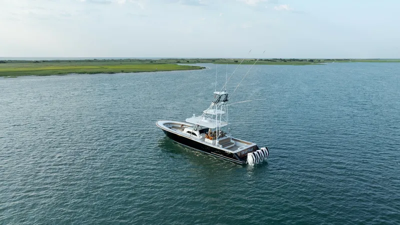 Slide: The Image of Aerial View of Valhalla V-46 This image showcases the Valhalla V-46 from an aerial perspective, highlighting its sleek design and spacious deck. The vessel features a prominent tower and well-equipped cockpit, perfect for fishing or leisure. Its elegant lines and modern aesthetics ar - 7162332