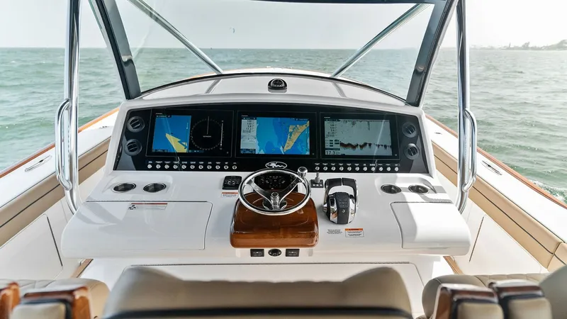 Slide: The Image of Helm Station with Advanced Electronics The helm station of the 2022 Valhalla Boatworks V-46 offers cutting-edge navigation technology with a sleek design. Featuring multiple high-resolution displays, the console provides comprehensive control and monitoring capabilities. Comfortable seating an - 6845068