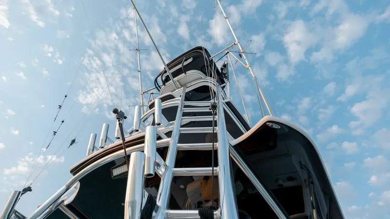 Slide: The Image of Tower and Outriggers View The image showcases the MarMar's sleek tower and outriggers, highlighting the vessel's impressive fishing capabilities. The polished metal finish and streamlined design underscore the yacht's modern aesthetic and attention to detail. This elevated vantage - 7162301