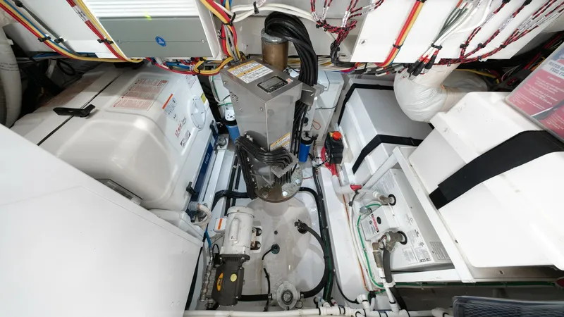 Slide: The Image of Advanced Engine Room Systems The engine room of the 2022 Valhalla Boatworks V-46 showcases cutting-edge systems and meticulous organization. The area features high-quality components, including a robust generator and advanced wiring, ensuring reliable performance. This well-structure - 7162316