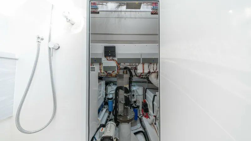 Slide: The Image of Engine Room Access and Shower Area This image showcases the engine room access from the shower area on the MarMar V-46. The sleek, modern design of the shower complements the practicality of the engine room entry, featuring easy-to-clean surfaces and efficient space utilization. The engine - 7162314