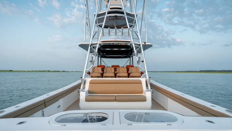 Slide: The Image of Stern Seating and Tower View This image showcases the stern of the 2022 MarMar V-46 by Valhalla Boatworks, featuring luxurious tan seating and a sleek, modern tower. The spacious deck area is designed for comfort, with ample seating that invites relaxation and socializing. The tower - 7162279