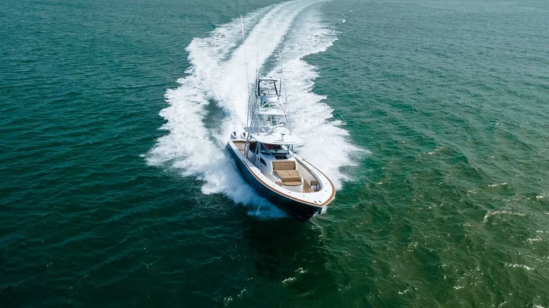 Slide: The Image of Aerial View of V-46 in Motion The Valhalla Boatworks V-46 cuts through the water with exceptional grace, showcasing its sleek design and powerful performance. From an aerial perspective, the vessel's spacious deck and stylish lines are visible, emphasizing its luxury and craftsmanship - 6845090