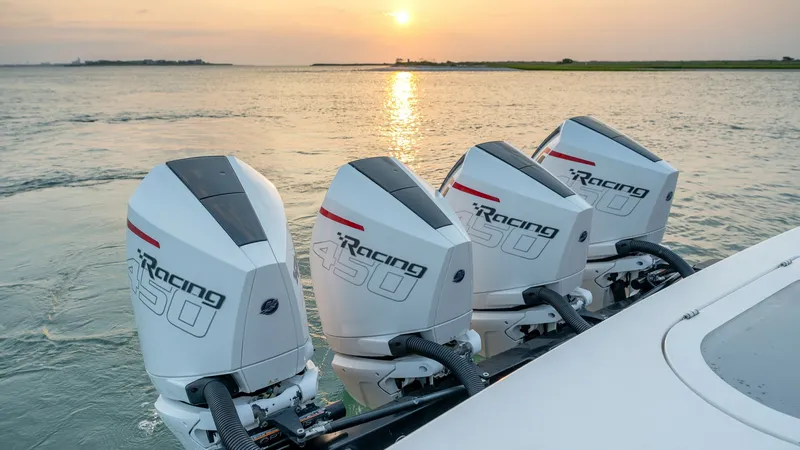 Slide: The Image of Quad Outboard Engines at Sunrise This image showcases the powerful quad outboard engines on the 2022 Valhalla Boatworks V-46, highlighting their robust design and performance capabilities. The engines are set against a serene sunrise backdrop, emphasizing the vessel's readiness for high- - 7162293