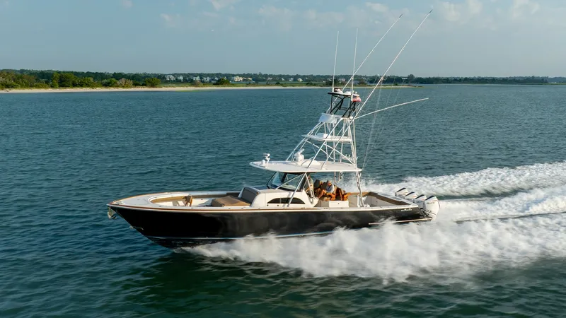 Slide: The Image of Side Profile in Motion This image showcases the dynamic side profile of the 2022 MarMar V-46 by Valhalla Boatworks. The sleek hull design and powerful outboard engines emphasize its performance capabilities, while the elevated tower provides an excellent vantage point for navig - 7162325