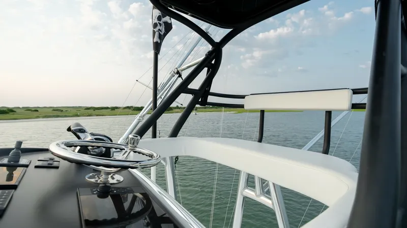 Slide: The Image of Flybridge Helm Station The flybridge helm station of the 2022 Valhalla V-46 offers a commanding view with a sleek, modern design. Featuring a stainless steel steering wheel and state-of-the-art navigation controls, it provides the perfect blend of functionality and style. The c - 7162303