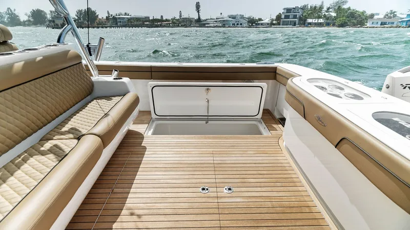 Slide: The Image of Spacious Aft Deck with Seating The aft deck of the 2022 Valhalla V-46 offers ample space for relaxation and socializing, featuring luxurious, cushioned seating with elegant stitching. The teak decking adds a touch of sophistication and durability, perfect for outdoor activities. Notabl - 6845070