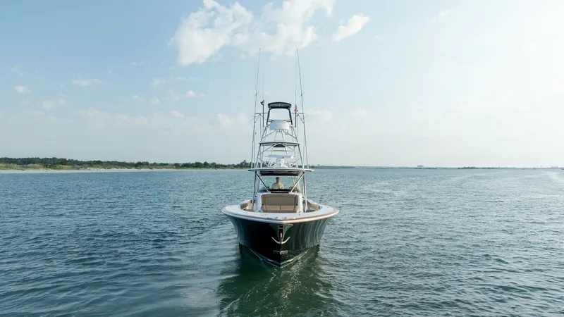 Slide: The Image of Bow View with Tower This image showcases the sleek bow of the 2022 MarMar V-46 by Valhalla Boatworks, cutting through the water with elegance. The vessel features a robust tower, ideal for spotting fish or enjoying panoramic ocean views. Its streamlined design and polished f - 7162319