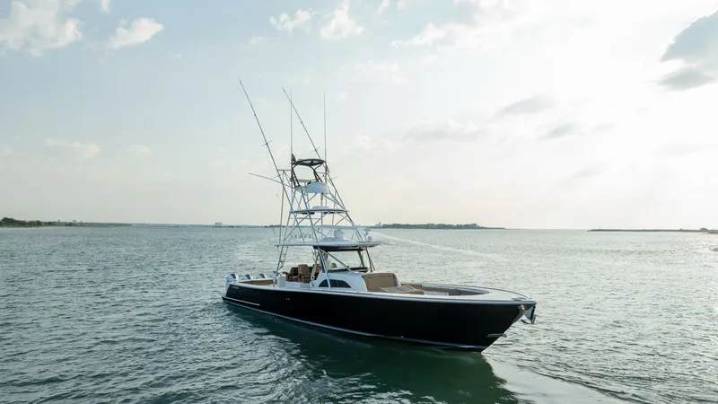 Slide: The Image of Valhalla V-46 Exterior Bow View The Valhalla V-46 showcases a sleek, modern design with a striking profile on the water. The vessel features an expansive bow area, ideal for relaxation and sunbathing, complemented by a sturdy tower for optimal sightlines. Its elegant lines and robust co - 7162328