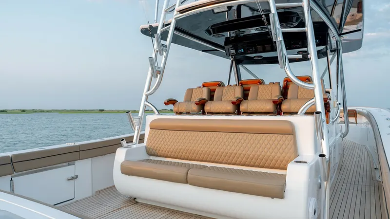 Slide: The Image of Spacious Helm Seating Area The MarMar V-46 by Valhalla Boatworks features a luxurious helm seating area with plush, diamond-stitched upholstery and ergonomic design for maximum comfort. The elevated seating offers a commanding view, perfect for navigating with ease. Finished with s - 7162299