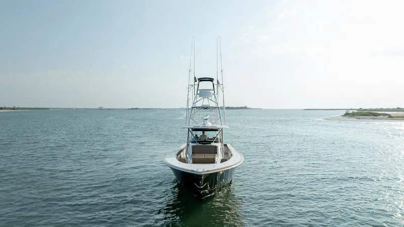 Slide: The Image of Bow View with Tower Structure The Valhalla V-46 showcases its sleek bow design, cutting gracefully through the water. Prominently featuring a robust tower structure, this vessel is equipped for both leisure and sport fishing. The open sea and clear skies enhance the allure of this mod - 7162331