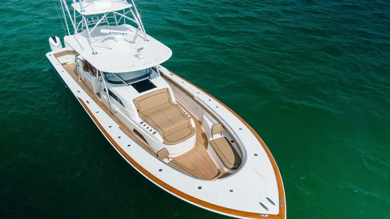 Slide: The Image of Aerial View of Forward Deck This stunning aerial view showcases the expansive forward deck of the MarMar V-46 by Valhalla Boatworks. The deck features elegant teak finishes and plush sunbathing lounges, perfect for relaxation. The sleek, modern design is complemented by a spacious l - 6845085