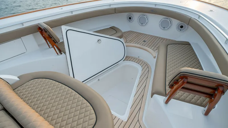 Slide: The Image of Bow Seating Area with Storage The Valhalla V-46 features a spacious bow seating area with elegant quilted upholstery and integrated backrests for comfort. The teak decking adds a touch of luxury, while the easily accessible storage compartment ensures functionality and convenience. Th - 7162284