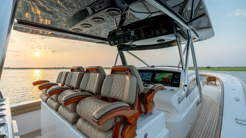 Slide: The Image of Helm Seating and Console The helm of the 2022 Valhalla Boatworks V-46 features luxurious, quilted leather seats with rich wooden armrests, providing both comfort and style. The state-of-the-art console is equipped with cutting-edge navigation technology, perfectly positioned unde - 7162289
