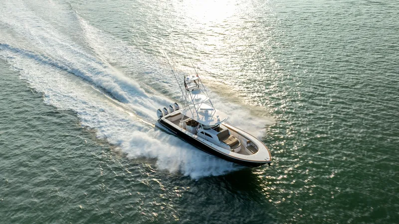 Slide: The Image of Aerial View of Valhalla V-46 Experience the thrill of the Valhalla V-46 slicing through the water with precision and power. This aerial perspective showcases the vessel's sleek design and robust performance, driven by four powerful outboard engines. The spacious deck and elegant line - 7162324