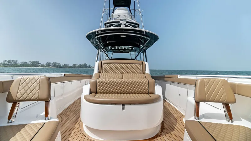 Slide: The Image of Spacious Aft Deck Seating Area The aft deck of the 2022 Valhalla V-46 features luxurious, diamond-stitched seating, offering comfort and style for relaxation and socializing. The teak decking complements the elegant design, providing a durable and aesthetic flooring option. This area i - 6845061