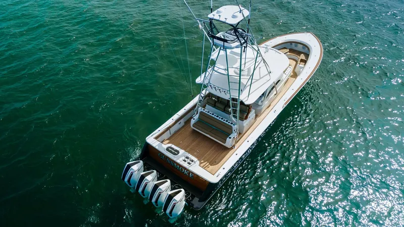 Slide: The Image of Aerial View of Aft Deck and Tower This stunning aerial shot showcases the aft deck of the 2022 MarMar by Valhalla Boatworks, model V-46. The vessel features a spacious deck with sleek teak finishes and an impressive tower for optimal visibility. Quad outboard engines provide exceptional p - 6845088