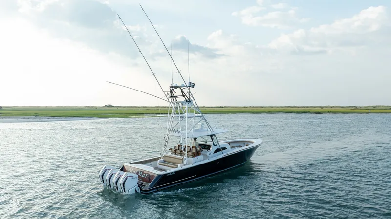 Slide: The Image of Aerial View of Sport Fishing Deck This aerial shot showcases the impressive fishing deck of the 2022 Valhalla Boatworks V-46, named MarMar. The vessel features powerful quad outboard engines, ideal for high-speed offshore adventures. The spacious aft deck is designed for sport fishing, co - 7162330
