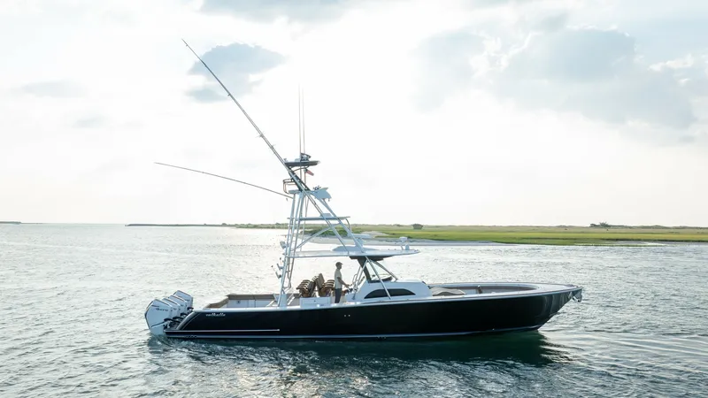 Slide: The Image of Starboard Profile with Tower and Outboards This image showcases the sleek starboard profile of the 2022 Valhalla V-46 by Valhalla Boatworks. The vessel features a striking tower for optimal visibility and a powerful set of outboard engines for superior performance. The elegant design is complement - 7162329
