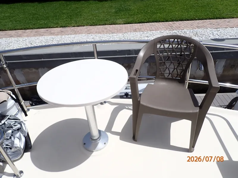 Slide: The Image of 40' Mainship sundeck table - 6848162