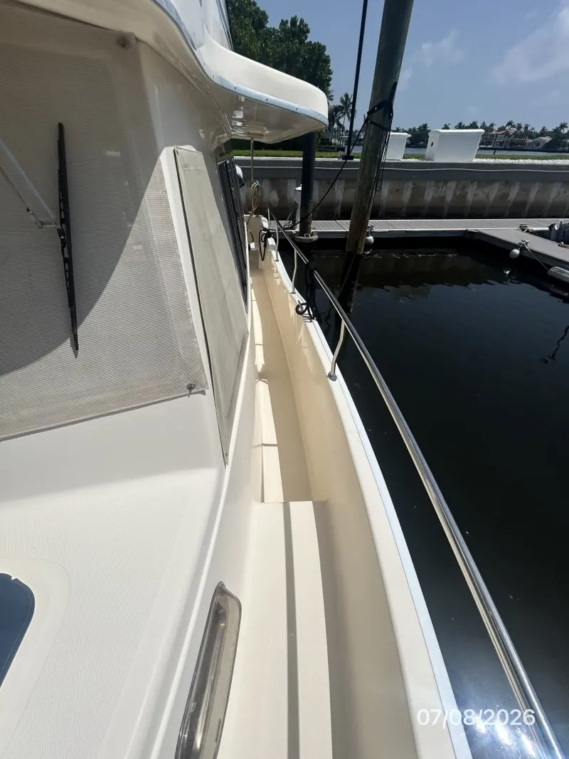 Slide: The Image of 40' Mainship port side deck2 - 6848137