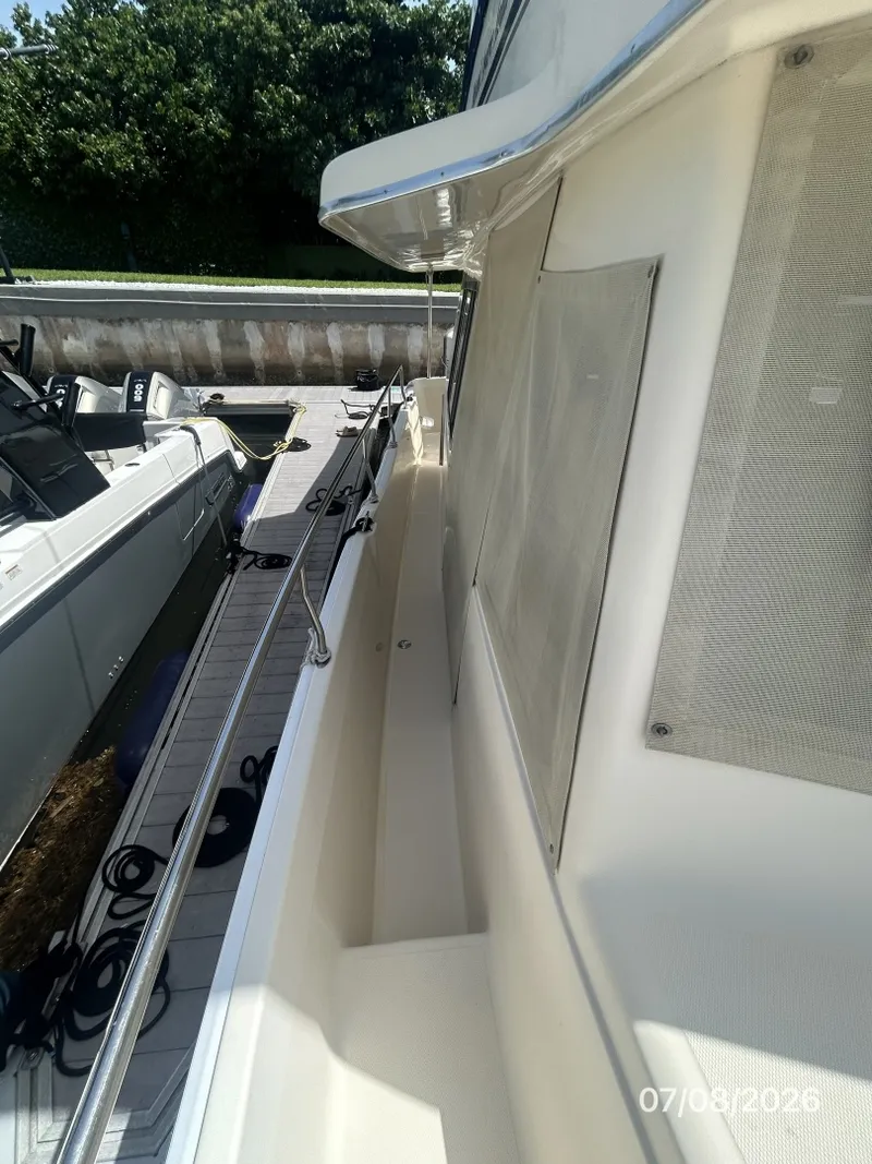 Slide: The Image of 40' Mainship starboard side deck2 - 6848153