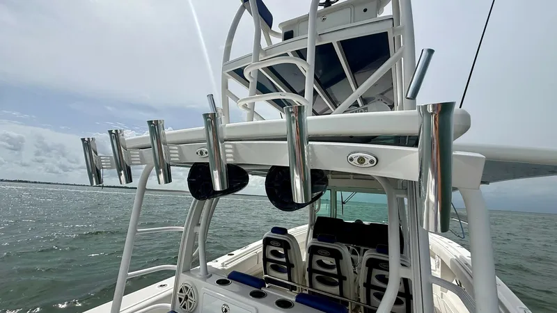 Slide: The Image of Fishing Tower and Seating Area This image showcases the fishing tower and ample seating area of the 2018 Hydra-Sports 4200 Siesta. The tower is equipped with multiple rod holders, catering to serious anglers. Below, comfortable seating with cushioned backing offers a space for relaxati - 7030819