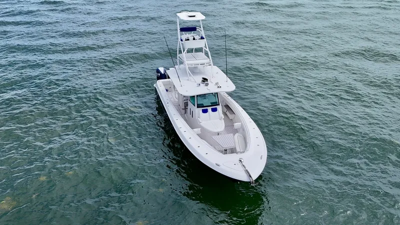 Slide: The Image of Aerial View of Bow and Helm This image showcases the sleek design of the 2018 Hydra-Sports 4200 Siesta's bow and helm. The spacious bow area offers ample seating and a clean deck layout, perfect for relaxation and entertainment. The helm is equipped with advanced navigation technolo - 7030846