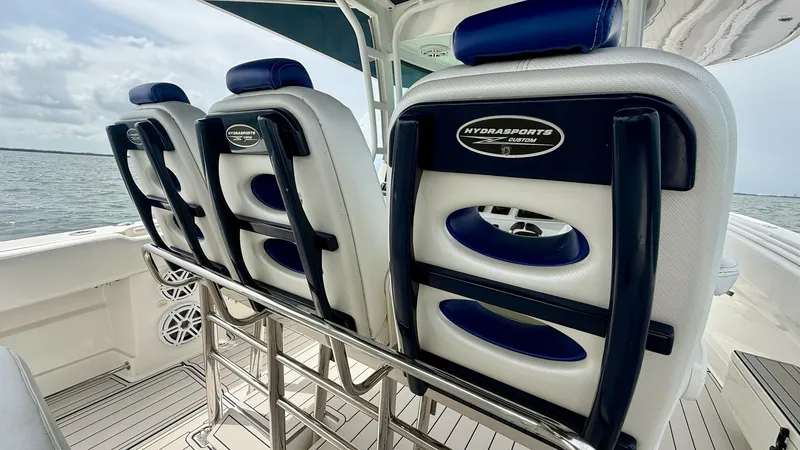 Slide: The Image of Helm Seating with Ocean View This image showcases the luxurious helm seating on the Hydra-Sports 4200 Siesta. The ergonomically designed chairs feature high-quality cushioning and sleek, modern accents, ensuring both comfort and style. Overlooking the serene ocean, this area offers a - 7030820